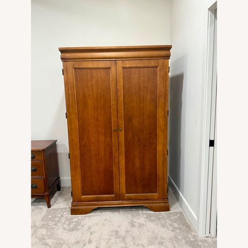 Used Solid Wood Armoire with Fold-Out Desk for sale on AptDeco