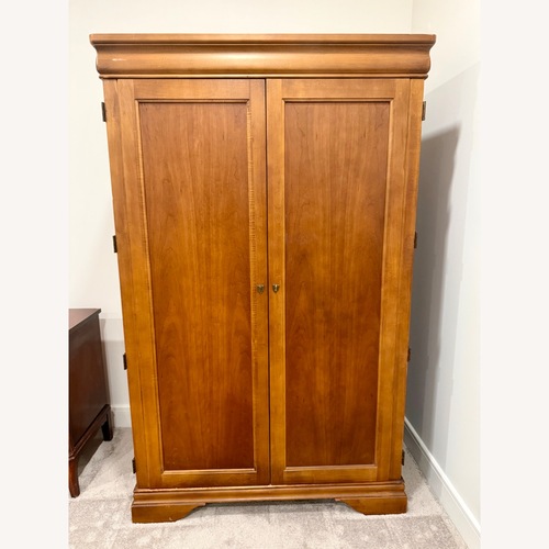 Used Solid Wood Armoire with Fold-Out Desk for sale on AptDeco