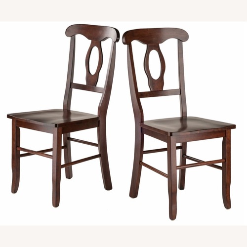 Used Pair of Dark Brown Wood Dining Chairs for sale on AptDeco
