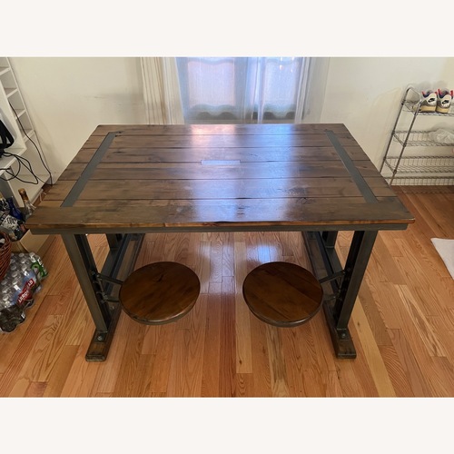 Used World Market Dark Brown Wood Dining Table for sale on AptDeco
