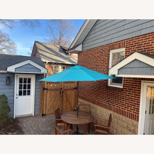 Used Frontgate  9 Foot Round Umbrella and Stand for sale on AptDeco