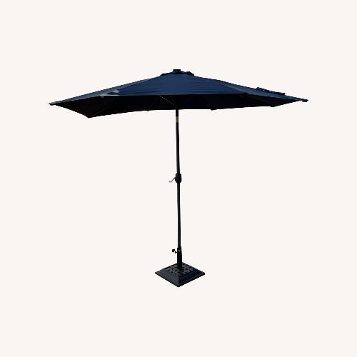Used Amazon 9 Foot Umbrella with Stand and Solar Lights for sale on AptDeco