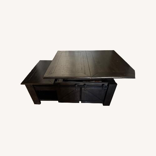 Used Living Spaces Dark Brown Coffee Table for sale on AptDeco