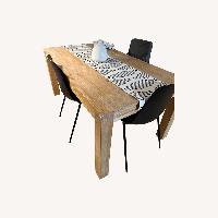 Article Natural Wood Dining Table with Black Chairs