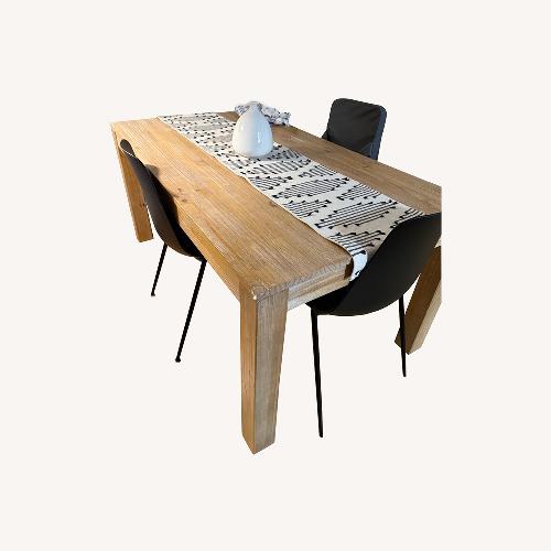 Used Article Natural Wood Dining Table with Black Chairs for sale on AptDeco