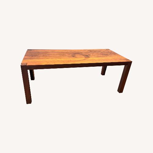 Used De La Espada Dark Brown Wood Dining Table for sale on AptDeco