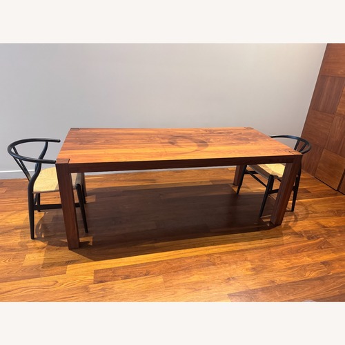 Used De La Espada Dark Brown Wood Dining Table for sale on AptDeco