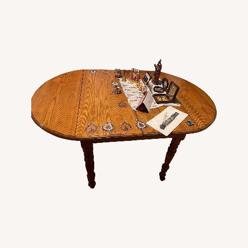 Used Light Brown Wood Dining Table for sale on AptDeco