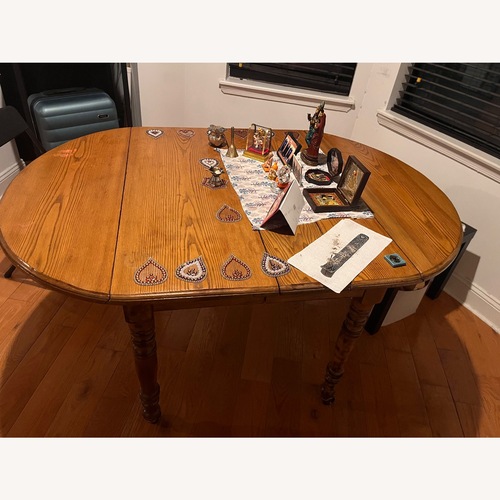 Used Light Brown Wood Dining Table for sale on AptDeco