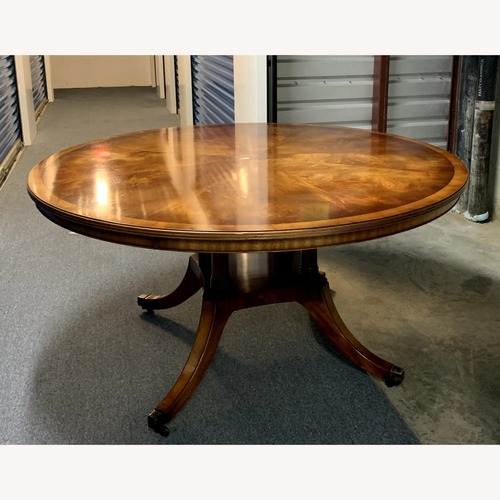 Used Bevan Funnell Round Wooden Dining Table for sale on AptDeco
