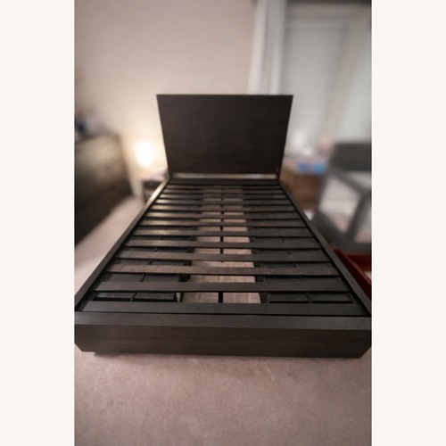 Used Living Spaces Dark Wood Queen Bed for sale on AptDeco