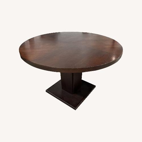 Used Round Wood Pedestal Dining Table for sale on AptDeco