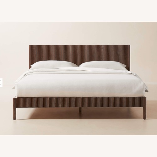 Used CB2 Siro Dark Brown Mindi Wood King Bed for sale on AptDeco