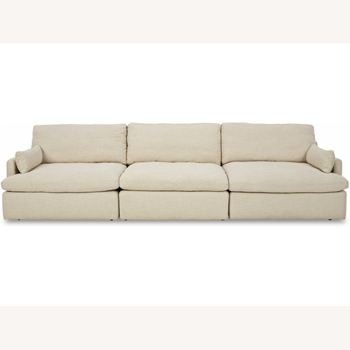 Used Ashley Furniture Tanavi Beige 3-Piece Sectional plus Ottoman for sale on AptDeco