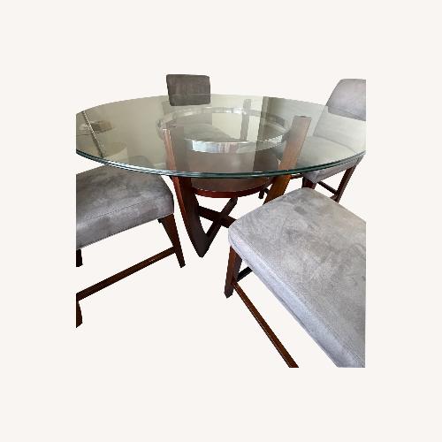 Used Value City Round Dining Table with Glass Top for sale on AptDeco