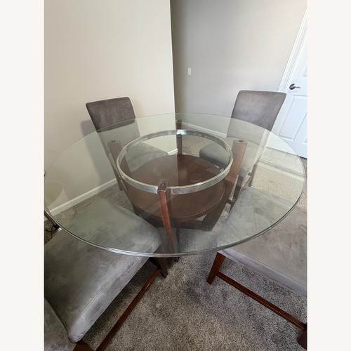 Used Value City Round Dining Table with Glass Top  for sale on AptDeco