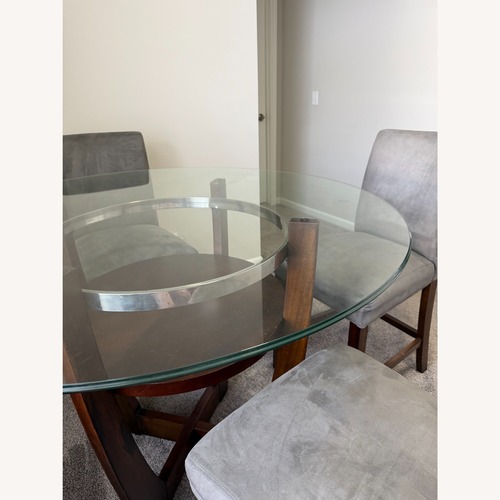 Used Value City Round Dining Table with Glass Top  for sale on AptDeco