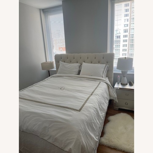 Used Pottery Barn Chesterfield Natural Queen Bed for sale on AptDeco