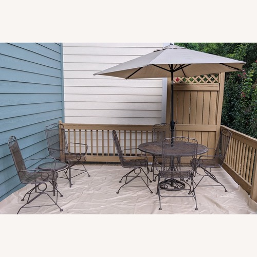 Used 10-Piece Wrought Iron Patio Furniture Set for sale on AptDeco