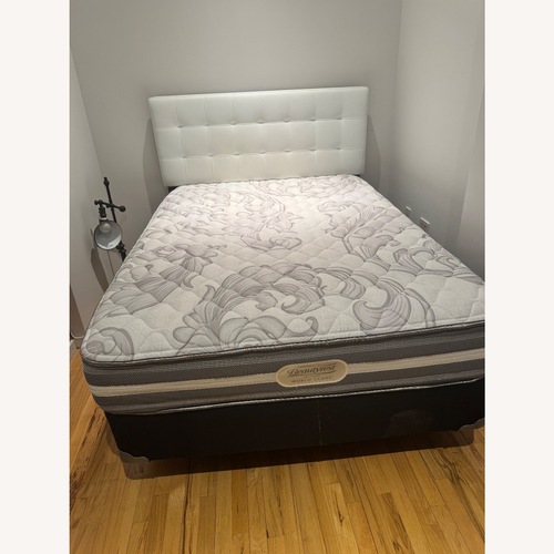 Used Full Bed Frame and White Faux Leather Headboard for sale on AptDeco