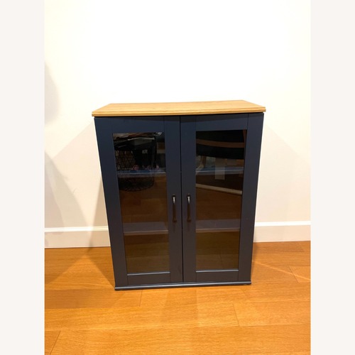 Used IKEA SKRUVBY Cabinet With Glass Doors for sale on AptDeco