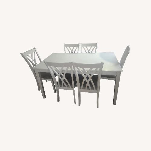 Used White Dining Room Table with 6 Chairs  for sale on AptDeco
