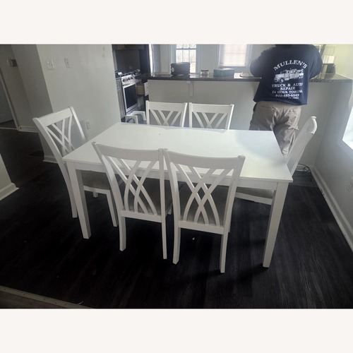 Used White Dining Room Table with 6 Chairs  for sale on AptDeco