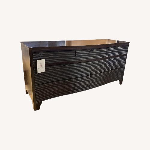 Used Brownstone 7-Drawer Wave Front Dark Wood Dresser for sale on AptDeco
