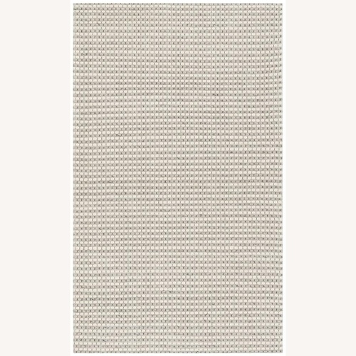 Used Safavieh Ivory Wool Area Rug for sale on AptDeco