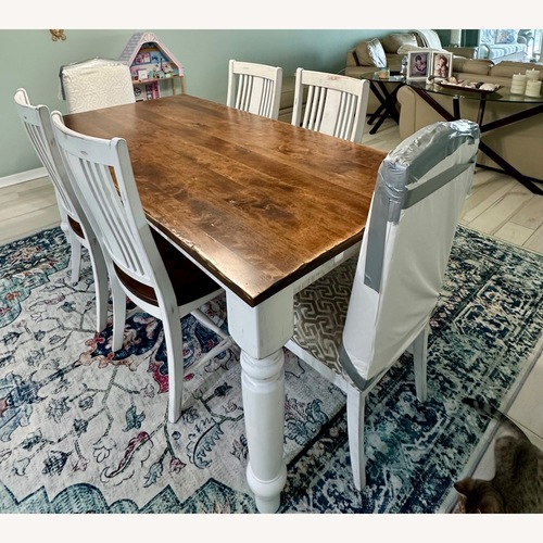 Used Dark Brown Wood Dining Table for sale on AptDeco