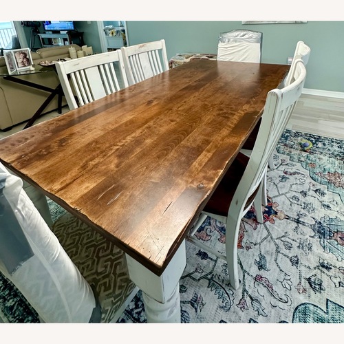 Used Dark Brown Wood Dining Table for sale on AptDeco