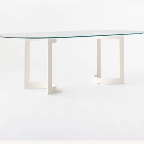 Used CB2 Transparent Orrin White Oval Dining Table for sale on AptDeco