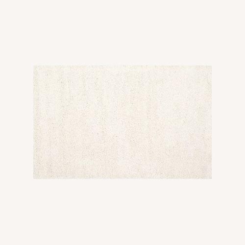 Used Safavieh Ivory Plus Rug for sale on AptDeco