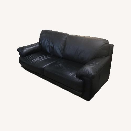 Used Low Two-Cushion Faux Leather Sofa Black for sale on AptDeco