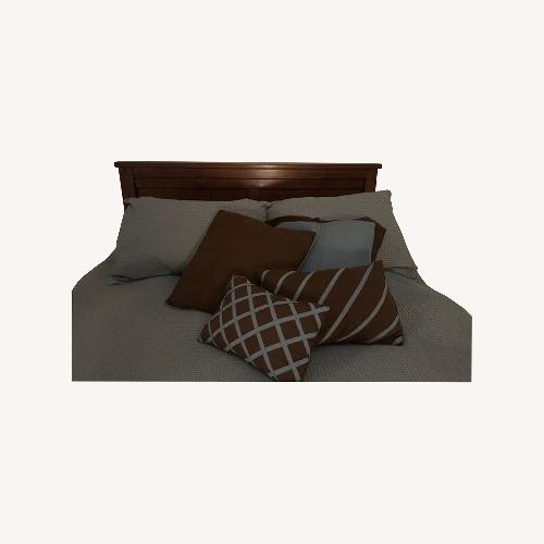 Used Dark Brown Wood Queen Bed for sale on AptDeco