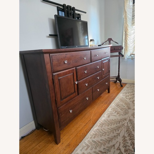 Used Vintage/Antique Dark Brown Wood Dresser for sale on AptDeco