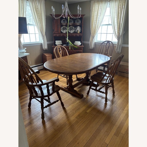 Used Dark Brown Wood Dining Table for sale on AptDeco