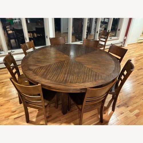 Used Dark Brown round table  Dining Set for 8 for sale on AptDeco