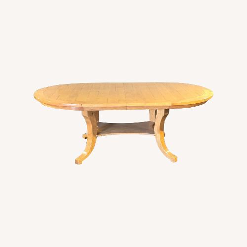 Used Bausman & Company Solid Wood Oval Dining Table for sale on AptDeco