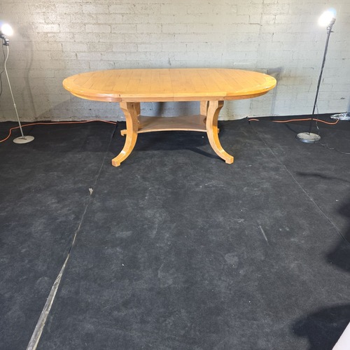 Used Bausman & Company Solid Wood Oval Dining Table for sale on AptDeco