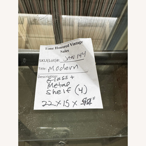 Used Black Metal and Glass Shelves With Wheels for sale on AptDeco