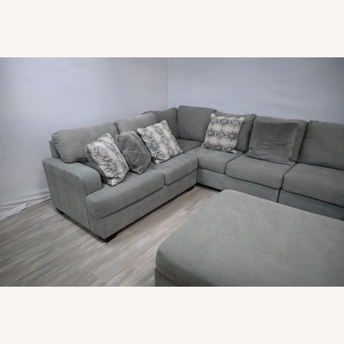 Used Ashley Furniture Sectional with Chaise and Ottoman for sale on AptDeco