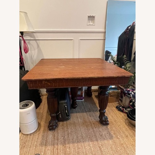 Used Dark Brown Wood Dining Table for sale on AptDeco