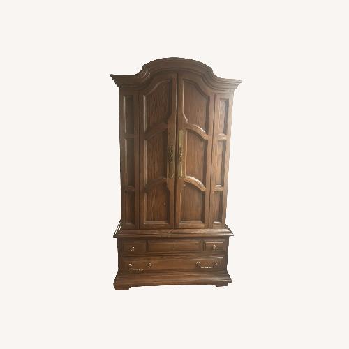 Used Vintage/Antique Dark Brown Solid Wood Armoire for sale on AptDeco