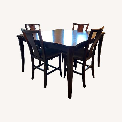 Used Rooms To Go Dark Brown Wood Dining Sets for sale on AptDeco