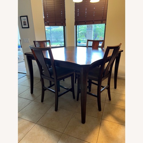 Used Rooms To Go Dark Brown Wood Dining Sets for sale on AptDeco
