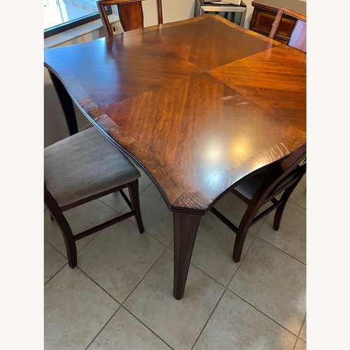 Used Rooms To Go Dark Brown Wood Dining Sets for sale on AptDeco