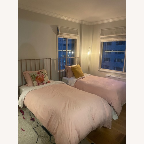 Used Pink Metal Twin Bed for sale on AptDeco