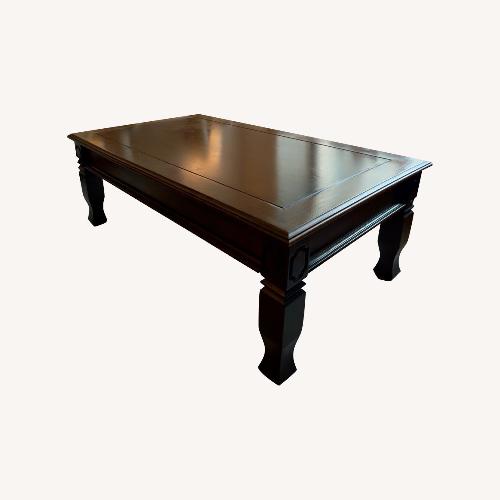 Used Dark Brown Wood Coffee Table for sale on AptDeco