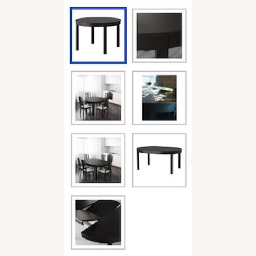 Used IKEA Bjursta Round Dining Table in Brown-Black for sale on AptDeco